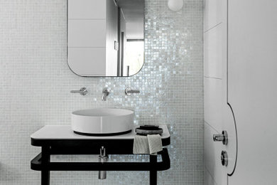 This is an example of a contemporary bathroom in Sydney with white tile, mosaic tile, white walls, a vessel sink, grey floor, white benchtops, a single vanity and a freestanding vanity.