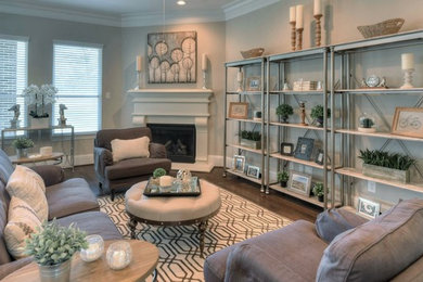 Inspiration for a mid-sized transitional open concept dark wood floor family room remodel in Houston with gray walls, a standard fireplace, a concrete fireplace and no tv