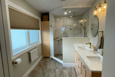 Bathroom - large contemporary porcelain tile porcelain tile, gray floor and double-sink bathroom idea in Toronto with shaker cabinets, light wood cabinets, a one-piece toilet, beige walls, an undermount sink, quartzite countertops, white countertops and a built-in vanity