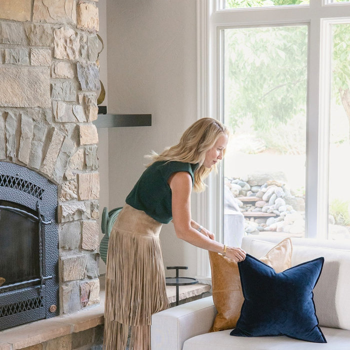 Layering leather pillows and a leather ottoman is a great way to add a fall trend into your home.