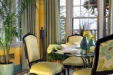 Example of a small beach style terra-cotta tile enclosed dining room design in New York with yellow walls and no fireplace