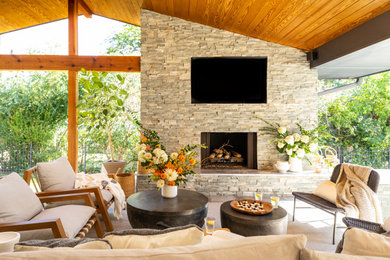 Mid-century modern patio photo in Other