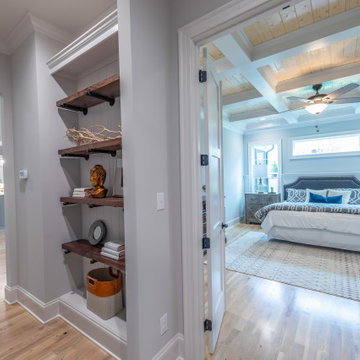 This picture window above the bed highlights the master bedroom
