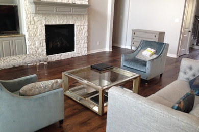 Inspiration for a mid-sized transitional open concept dark wood floor and brown floor living room remodel in Houston with white walls, a standard fireplace and a stone fireplace