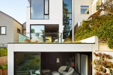 Modern three-story wood and clapboard house exterior idea in San Francisco