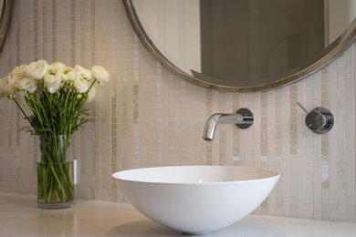 Photo of a modern master bathroom in Perth with beige tile and mosaic tile.