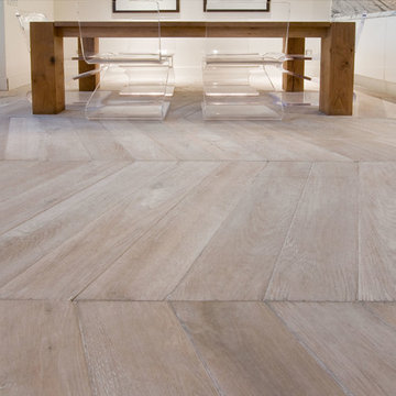 Dining Area Features Chevron Hardwood Flooring