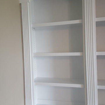 Double-Ached Fluted-Trim Fireplace Built-ins