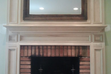 Dining room - traditional dining room idea with a standard fireplace and a brick fireplace