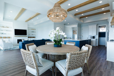 Inspiration for a coastal brown floor dining room remodel in Wilmington with a standard fireplace and a shiplap fireplace