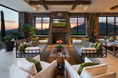 Huge trendy open concept travertine floor living room photo in Phoenix with a standard fireplace, a stone fireplace and a wall-mounted tv