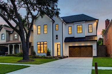 Large farmhouse white two-story mixed siding house exterior idea in Houston with a hip roof and a shingle roof