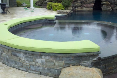 Example of a beach style pool design in Other