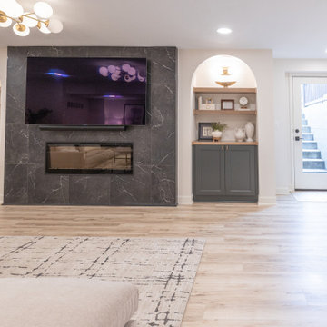 Warm & Inviting Basement Retreat with Custom Bar + Entertainment Center