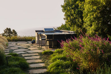 Inspiration for a mid-sized contemporary u-shaped slate floor and pink floor kitchen remodel in Santa Barbara with a single-bowl sink, flat-panel cabinets, stainless steel cabinets, marble countertops, blue backsplash, ceramic backsplash, stainless steel appliances and multicolored countertops