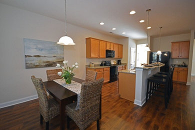 Transitional dark wood floor kitchen photo in Charleston with granite countertops