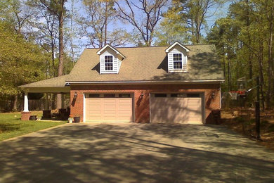 Example of a large classic detached two-car garage design in Raleigh