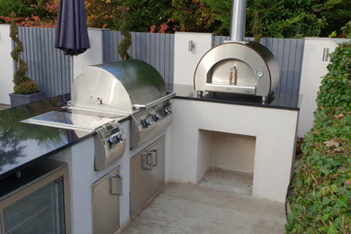 Modern Outdoor Kitchen With Fire Magic BBQ and Alfa Pizza Oven