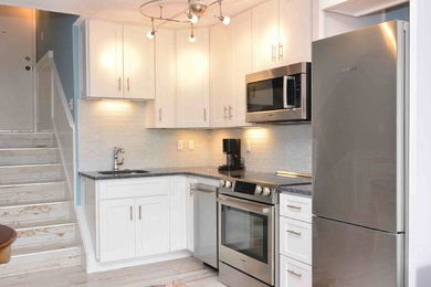 Example of a beach style kitchen design in Other