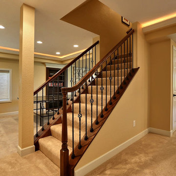 Open Basement Concept in Centennial, CO with tray ceilings and stacked stone