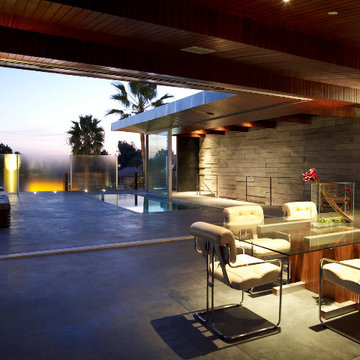 Modern Dining Area with Adjacent Rooftop Swimming Pool
