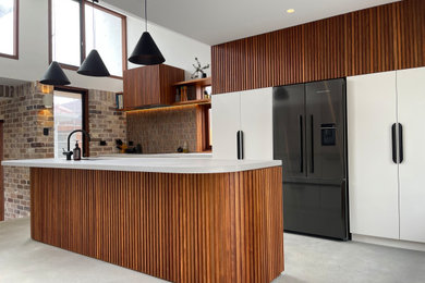 This is an example of a contemporary kitchen in Sydney.