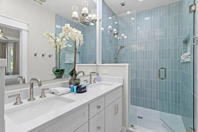 Inspiration for a coastal master blue tile double-sink bathroom remodel in Other