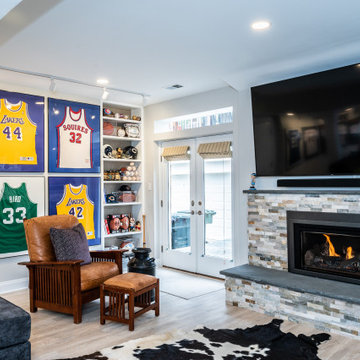 Entertainment System Placed Above Fireplace Providing Comforting Centerpiece