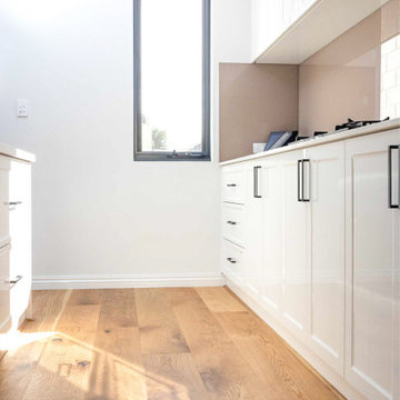 French Oak Smoked Flooring beautifully highlights white kitchen