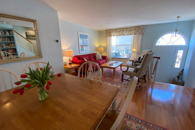 Living room - mid-sized french country open concept medium tone wood floor living room idea in DC Metro with blue walls