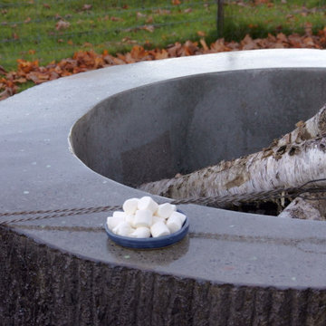 Concrete log fire pit with polished top and glow aggregate