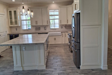Example of a transitional home design design in Miami