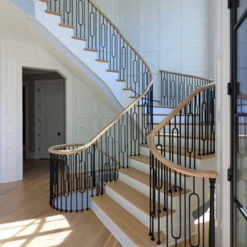 Project #95 | Freestanding Elliptical Staircase with Geometric Iron Balusters