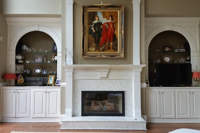 Example of a classic dark wood floor living room design in Atlanta with a standard fireplace and a tile fireplace