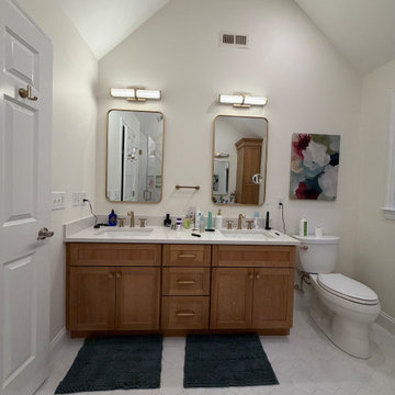 Custom Bathroom Renovation with Marble Herringbone Shower and Glass Enclosure