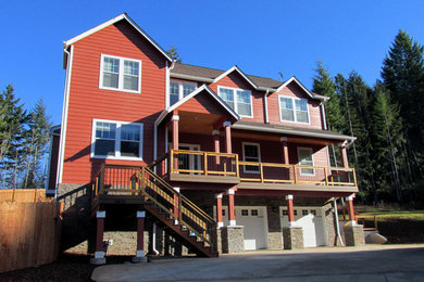 Large country three-story concrete fiberboard exterior home photo in Portland