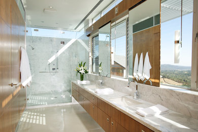 Example of a trendy white tile alcove shower design in Sacramento with an undermount sink, flat-panel cabinets and medium tone wood cabinets