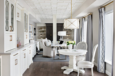 Home office - large contemporary freestanding desk medium tone wood floor home office idea in Toronto with gray walls