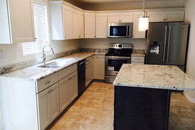 Large transitional ceramic tile eat-in kitchen photo in Other with a double-bowl sink, flat-panel cabinets, white cabinets, granite countertops, stainless steel appliances, an island, multicolored backsplash and stone slab backsplash