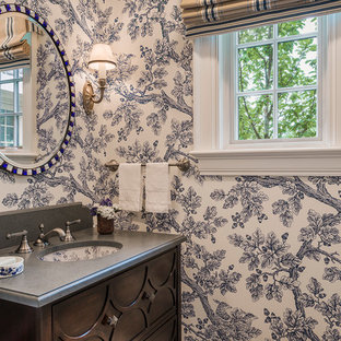 Idées déco pour une salle de bain classique avec un lavabo encastré, un placard en trompe-l'oeil, des portes de placard en bois sombre, un sol en brique, un mur multicolore et un plan de toilette gris.