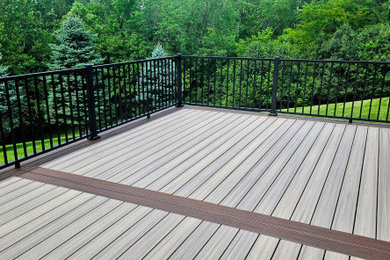 Inspiration for a large contemporary backyard second story metal railing deck remodel in Cincinnati with no cover