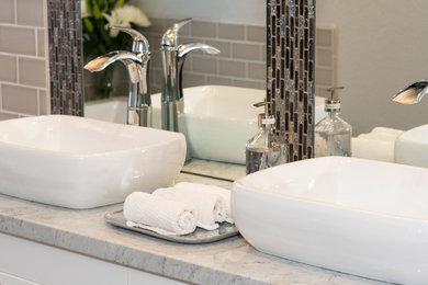 Inspiration for a large contemporary master gray tile and subway tile ceramic tile bathroom remodel in Phoenix with flat-panel cabinets, white cabinets, a two-piece toilet, gray walls, a vessel sink and marble countertops