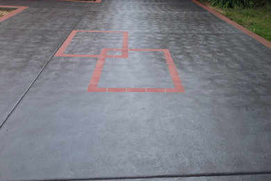 Coloured driveway - Charcoal colour-thru with Burgundy Header & Feature pattern