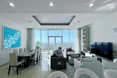 Esempio di un soggiorno minimalista di medie dimensioni e aperto con pareti bianche, pavimento in marmo, parete attrezzata, pavimento beige, soffitto ribassato e angolo bar
