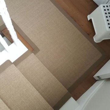 Brown Carpet with Brown Edgings Installed to Stairs