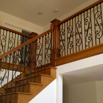 Curved iron scroll balusters