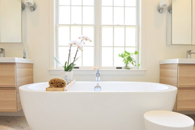 Inspiration for a mid-sized contemporary master white tile and ceramic tile ceramic tile bathroom remodel in Providence with light wood cabinets, white walls, an integrated sink, flat-panel cabinets and a one-piece toilet
