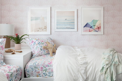 Kids' room - mid-sized coastal girl wallpaper kids' room idea in San Diego with pink walls