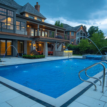 Burr Ridge Lap Pool with Raised Hot Tub and Waterfall