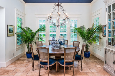 Inspiration for a mid-sized timeless terra-cotta tile and beige floor kitchen/dining room combo remodel in Austin with white walls and no fireplace